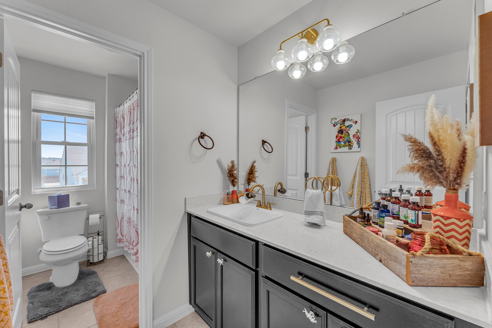 306 Cold Spg Loop Bastrop, TX 78602 - Photo 20 of 25 Full bath featuring vanity, tile patterned floors, toilet, and baseboards