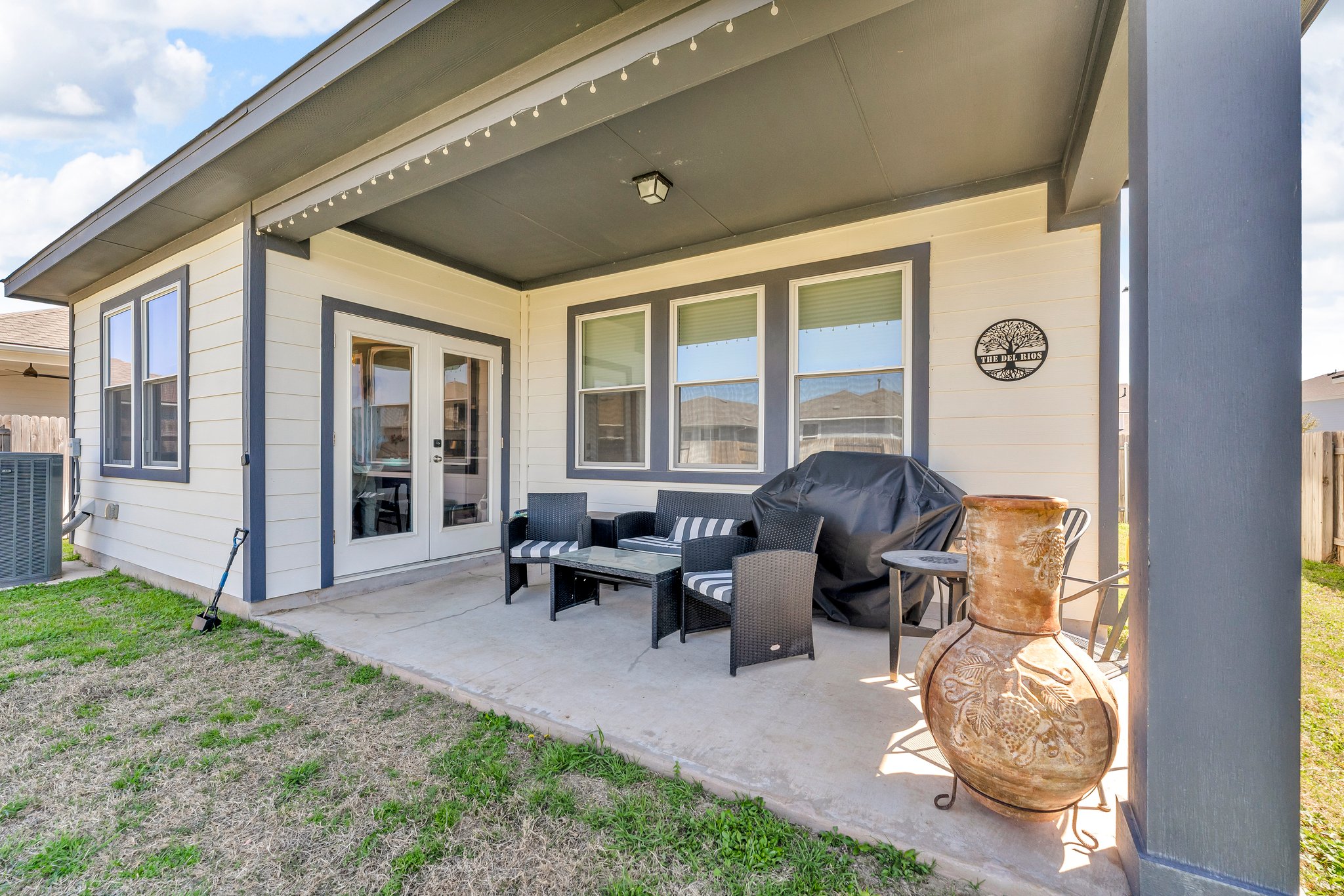 306 Cold Spg Loop Bastrop, TX 78602 - Photo 22 of 25 View of patio with area for grilling, cooling unit, and french doors
