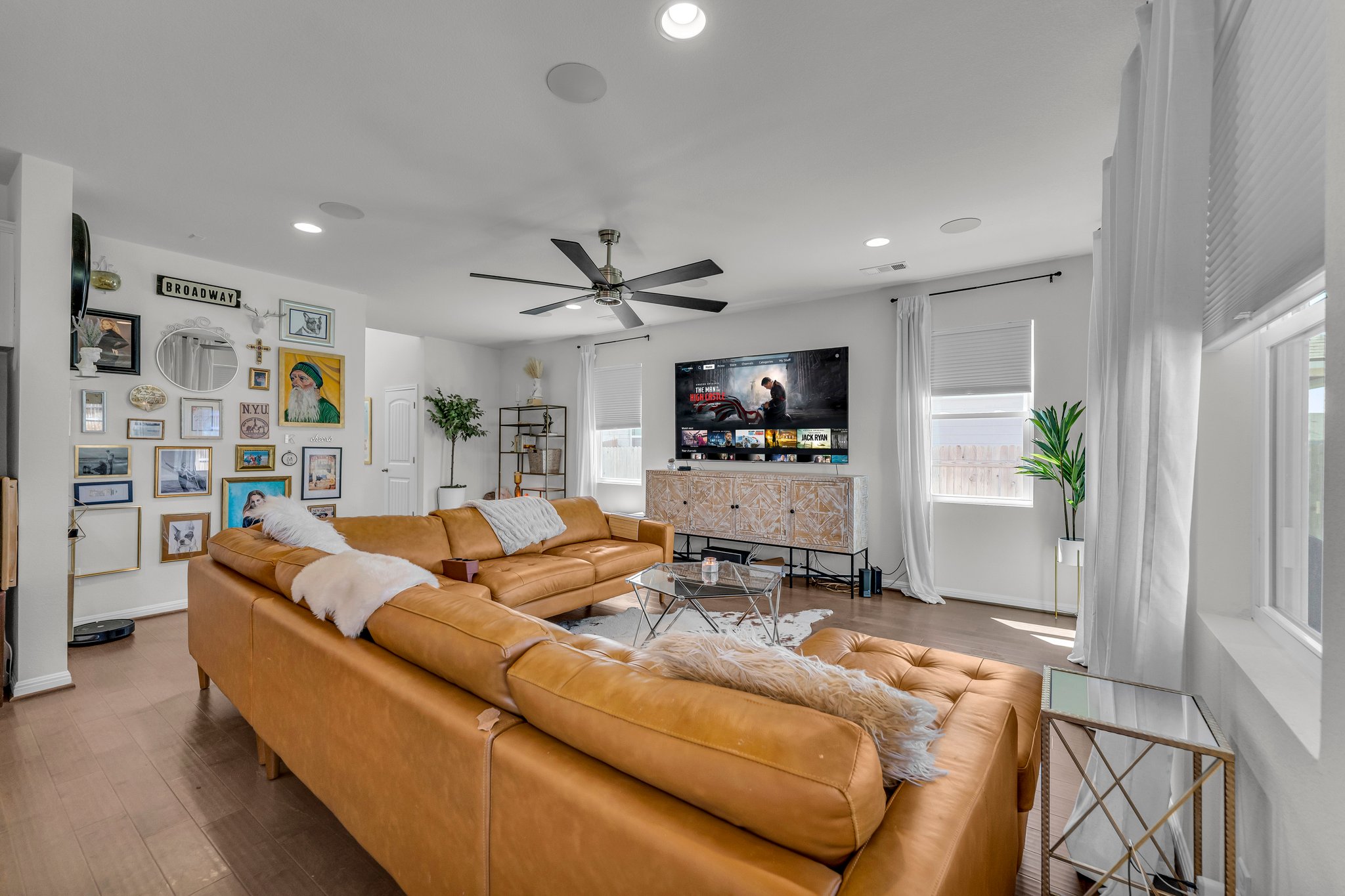 306 Cold Spg Loop Bastrop, TX 78602 - Photo 7 of 25 Living room with recessed lighting, baseboards, wood finished floors, and a fireplace