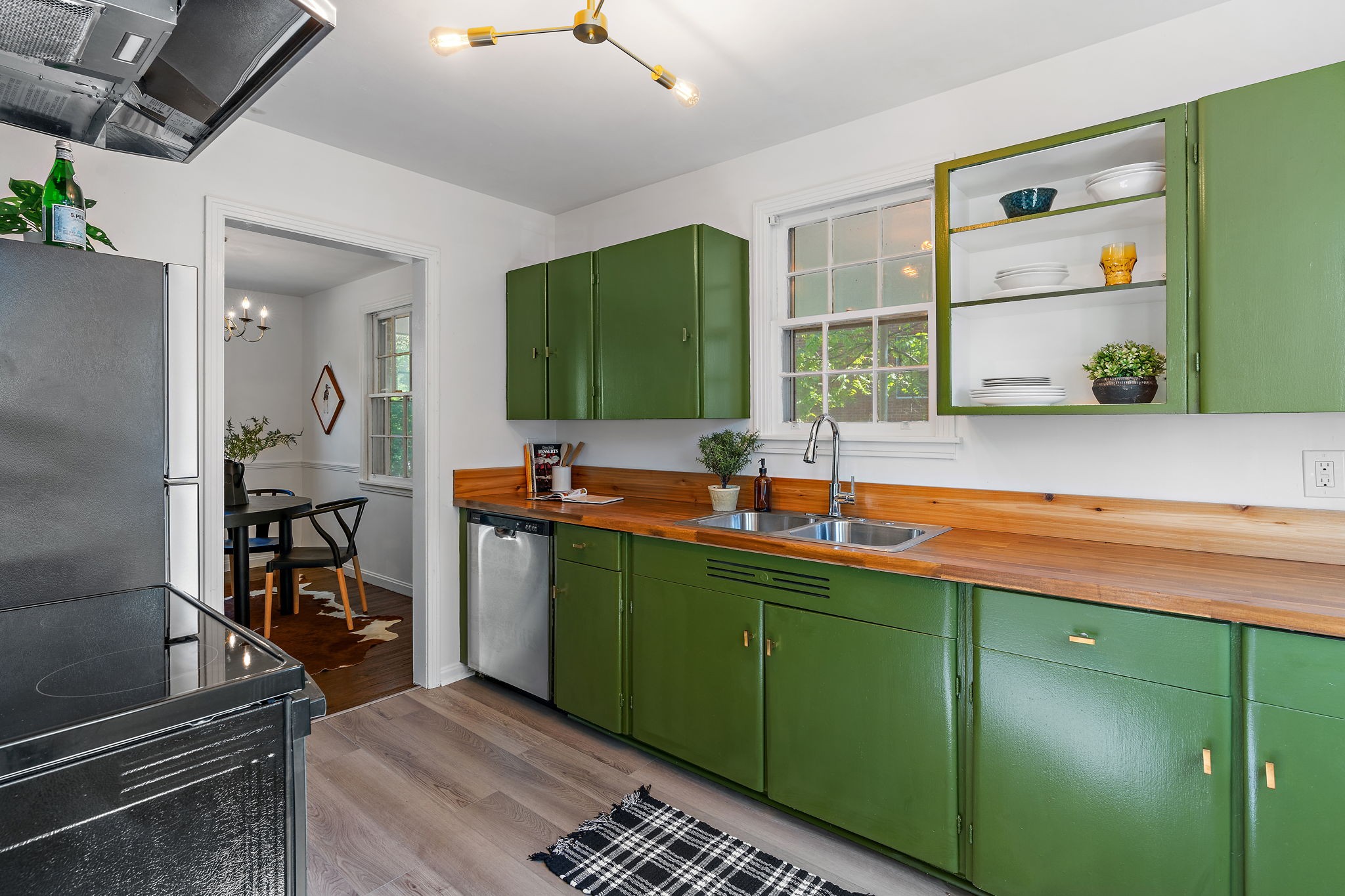 236 Barker Road Nashville, TN 37214 - Photo 11 of 45 New stainless appliances, gorgeous butcher block counters, built-in shelving and stylish finishes round out this cook's dream of a kitchen.