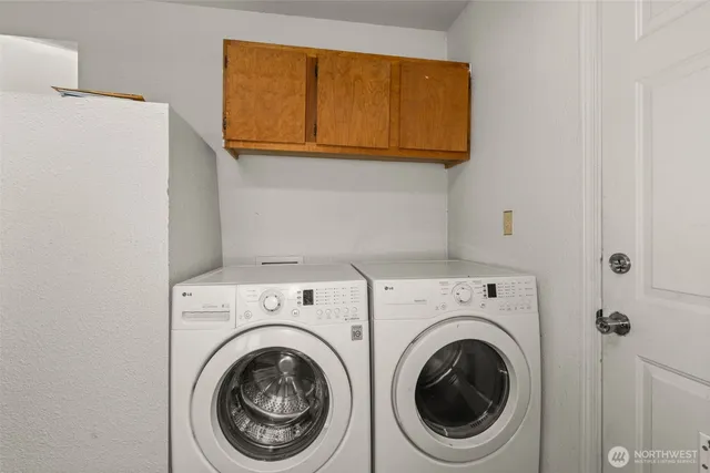 a view of backyard with deck and patio