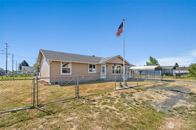 a front view of a house with a garage