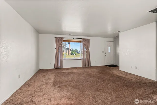 a kitchen with a refrigerator and a sink