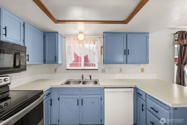 a kitchen with stainless steel appliances a refrigerator and a sink