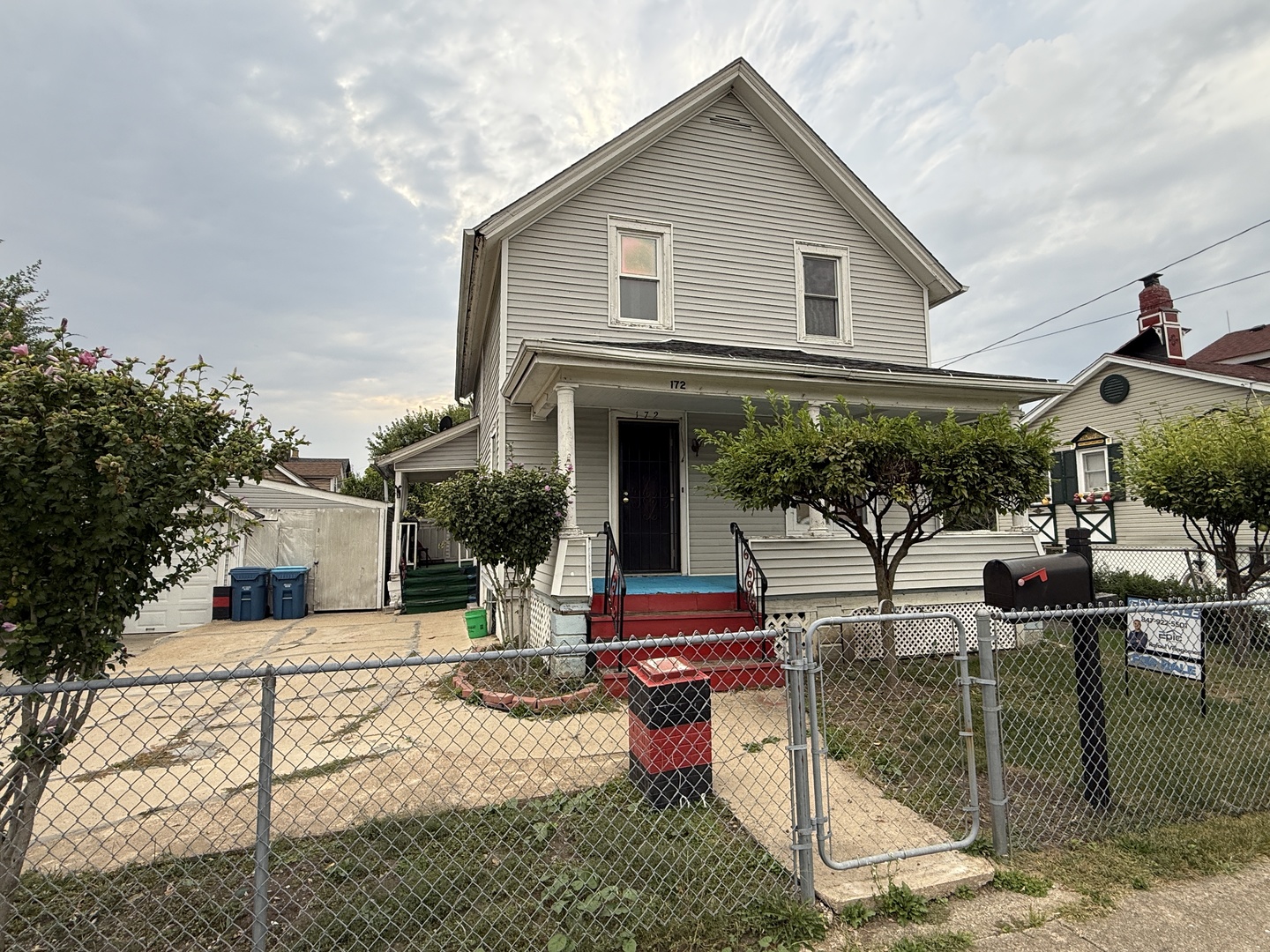 a patio with sofas fire pit table and chairs