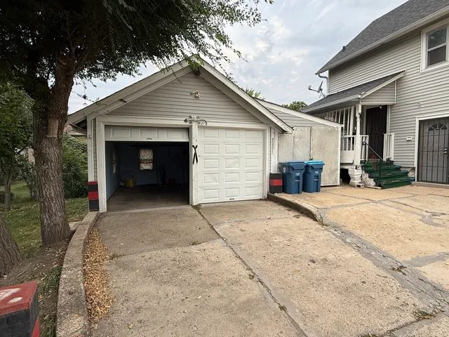 a view of a house with a yard and garage