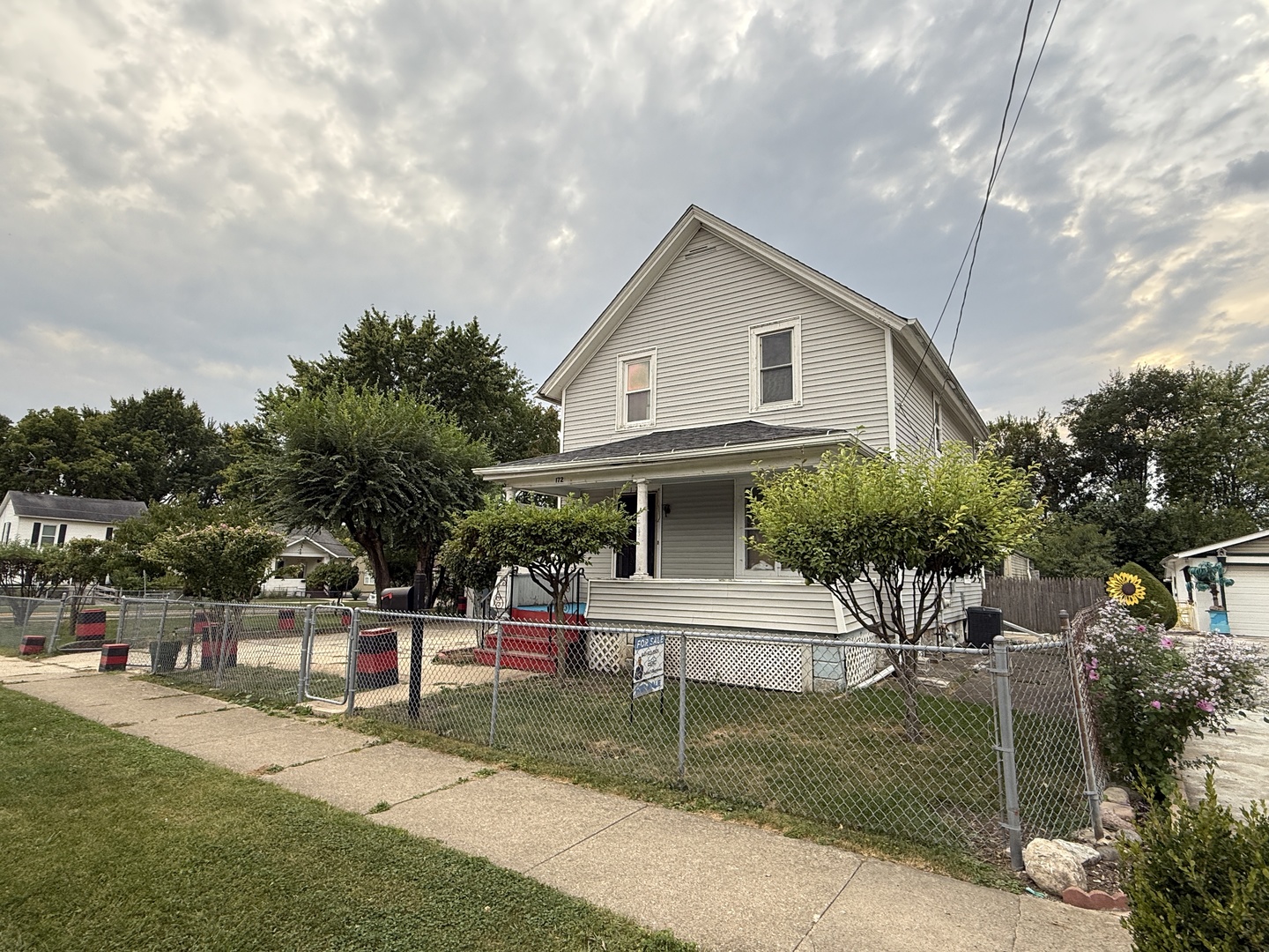 172 North East Avenue Aurora, IL 60505 - Photo 2 of 15 a view of house with outdoor space and garden