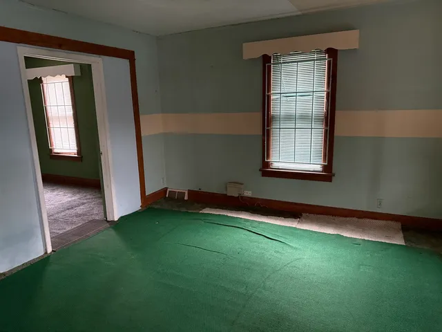 an empty room with windows