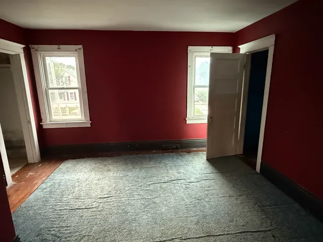 a view of an empty room and window
