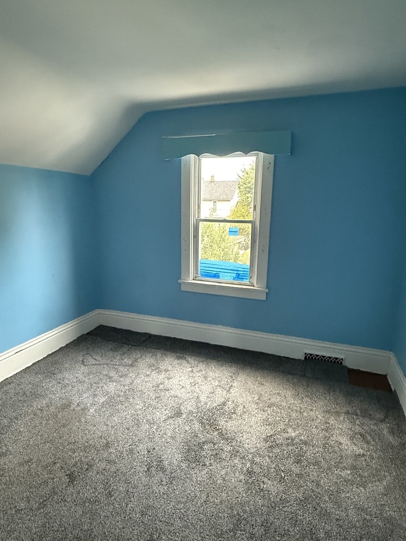172 North East Avenue Aurora, IL 60505 - Photo 10 of 15 an empty room with a window