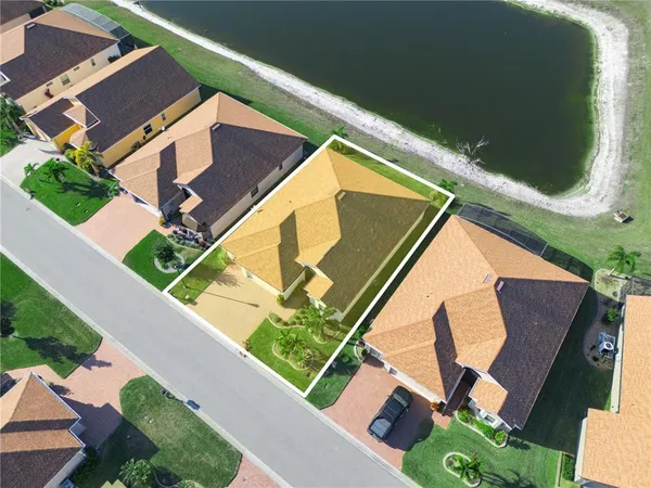 an aerial view of a house with outdoor space