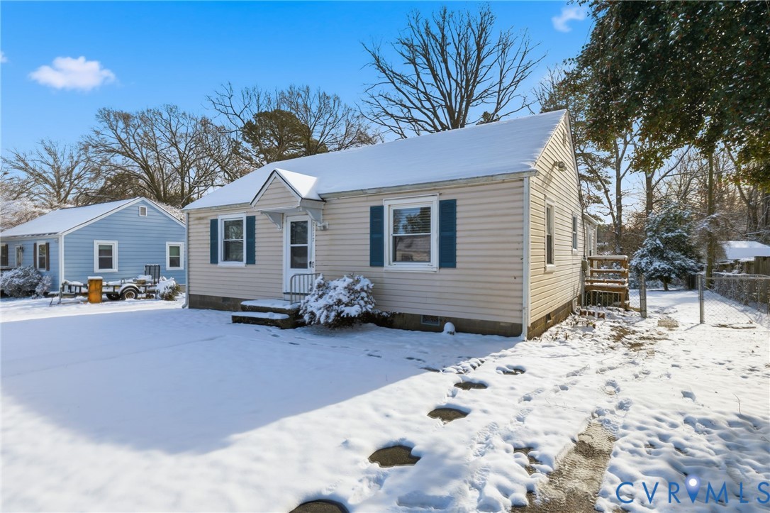 7117 Brigham Road Richmond, VA 23226 - Photo 2 of 20 a view of a house with a yard covered in snow