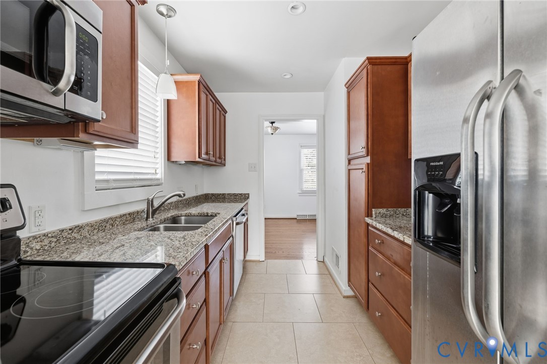 7117 Brigham Road Richmond, VA 23226 - Photo 7 of 20 a kitchen with a sink stove and refrigerator