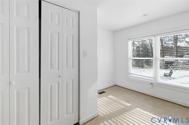 a view of a room that has a window in it