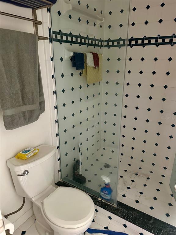 300 Broadview Avenue Altamonte Springs, FL 32701 - Photo 11 of 33 a white toilet sitting next to a shower curtain