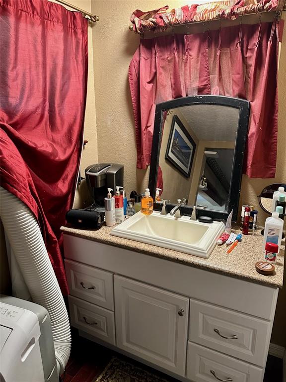 300 Broadview Avenue Altamonte Springs, FL 32701 - Photo 12 of 33 a bathroom with a sink and a mirror