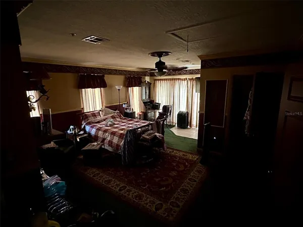 a living room with furniture rug and window