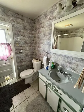 a bathroom with a bathtub and a toilet