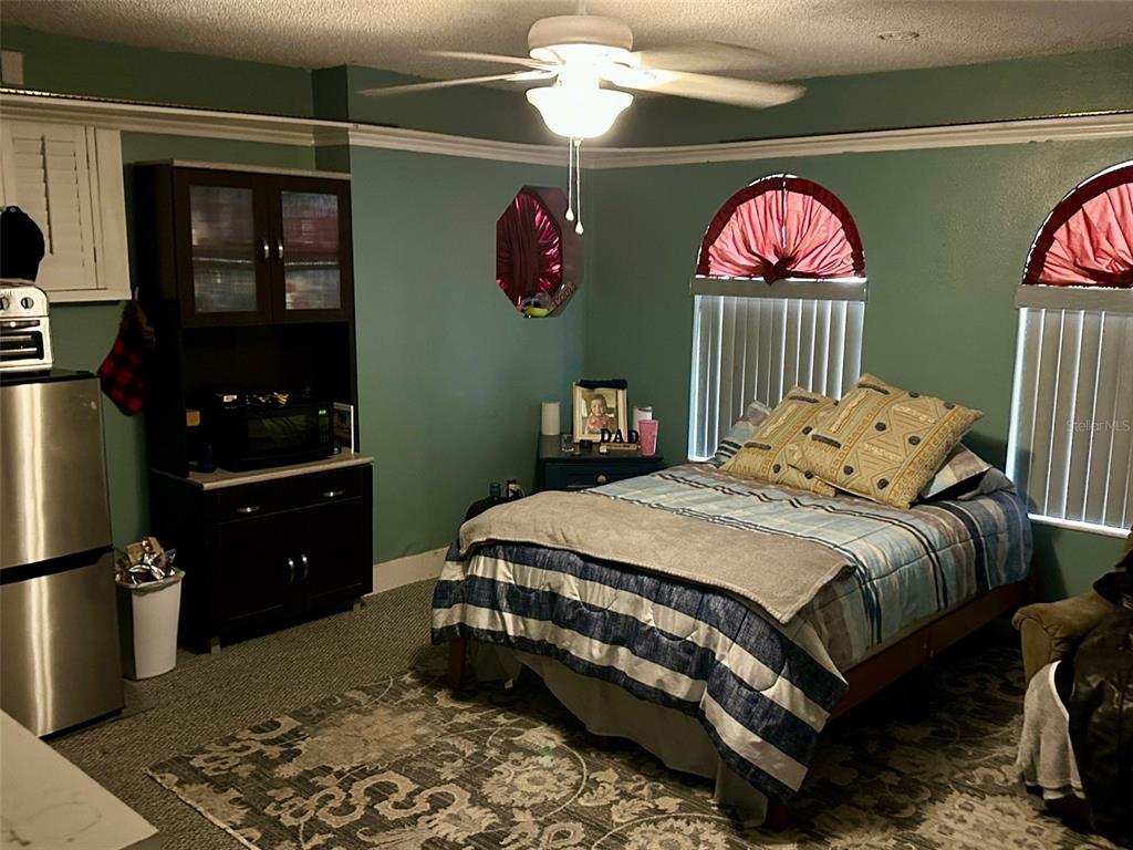 300 Broadview Avenue Altamonte Springs, FL 32701 - Photo 20 of 33 a bedroom with a bed and wooden floor
