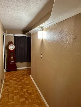 a room with gym equipment and a flat screen tv