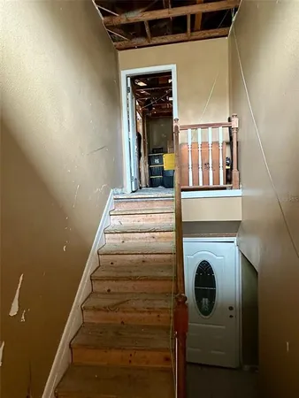 a view of a dining room with furniture and a chandelier