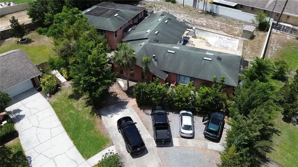 an aerial view of a house with garden space and sitting space