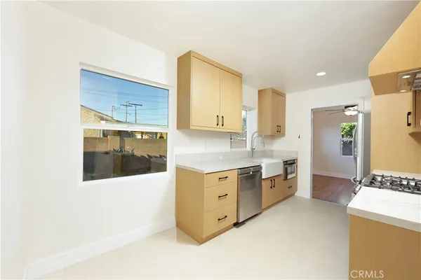a kitchen with white cabinets