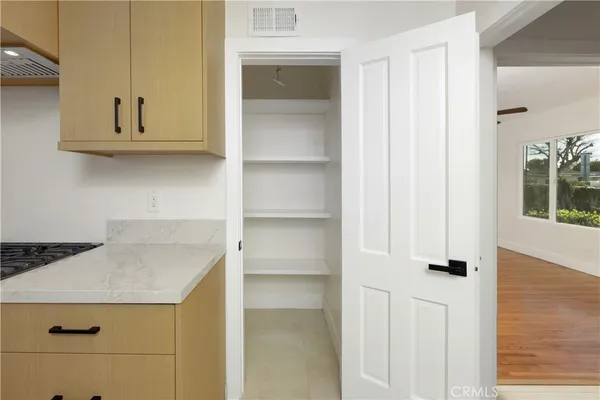a kitchen with a refrigerator and cabinets