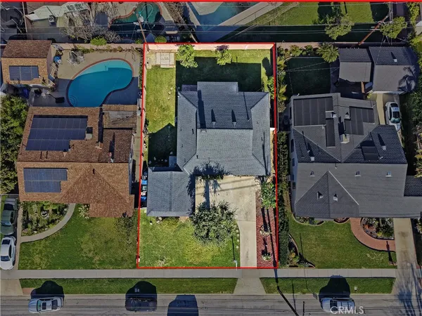 an aerial view of residential houses with outdoor space