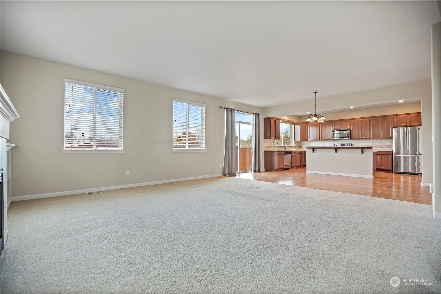 1534 Farina Loop Southeast Olympia, WA 98513 - Photo 16 of 38 a view of empty room with kitchen and window