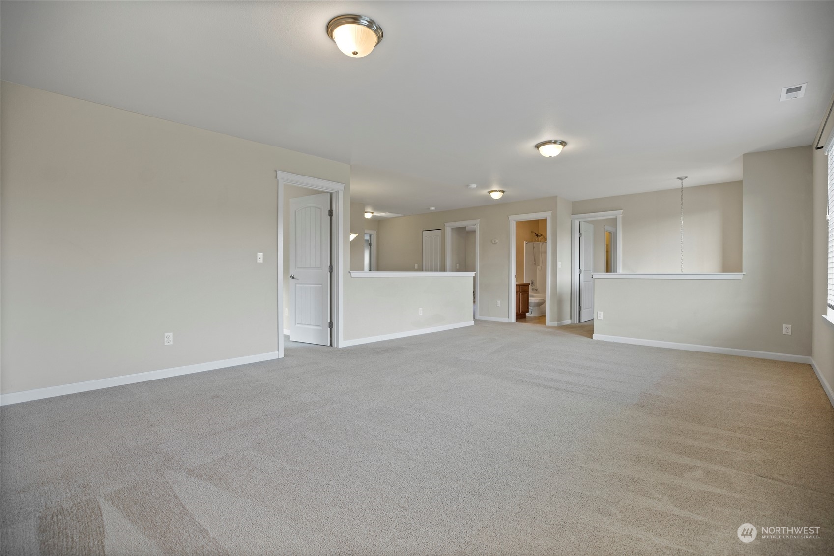 1534 Farina Loop Southeast Olympia, WA 98513 - Photo 19 of 38 a view of an empty room with a kitchen