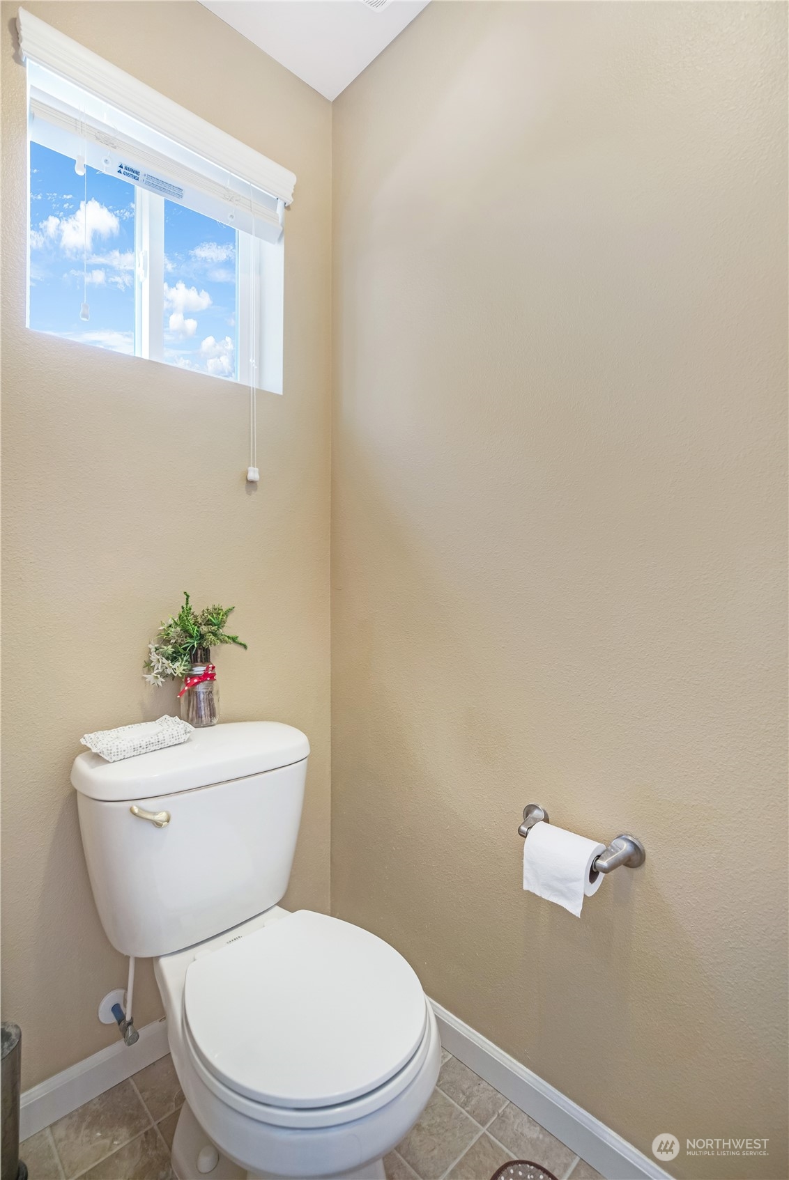 1534 Farina Loop Southeast Olympia, WA 98513 - Photo 25 of 38 a white toilet sitting next to a bathroom sink