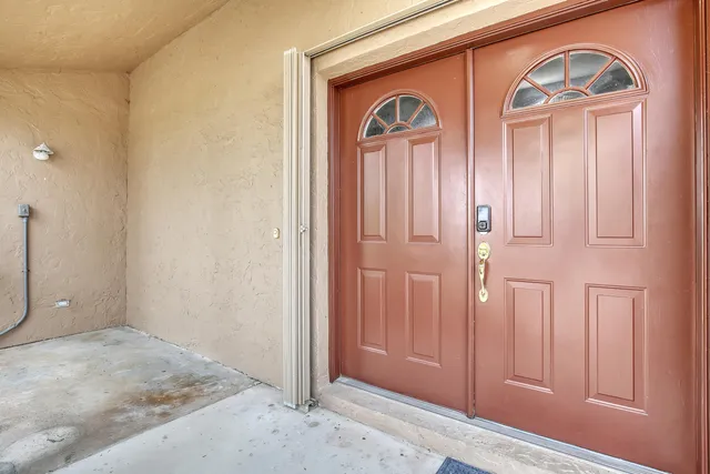 a view of a hallway with front door