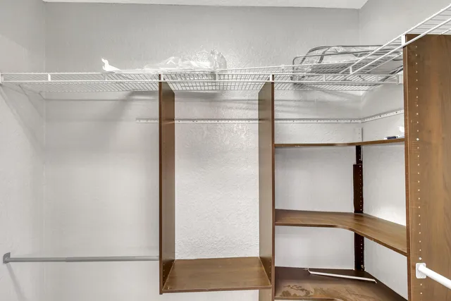 a bedroom with a bed and a television