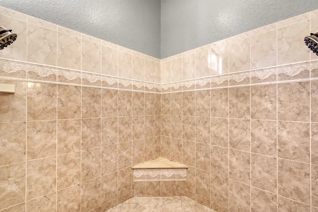 a bedroom with furniture and a flat screen tv