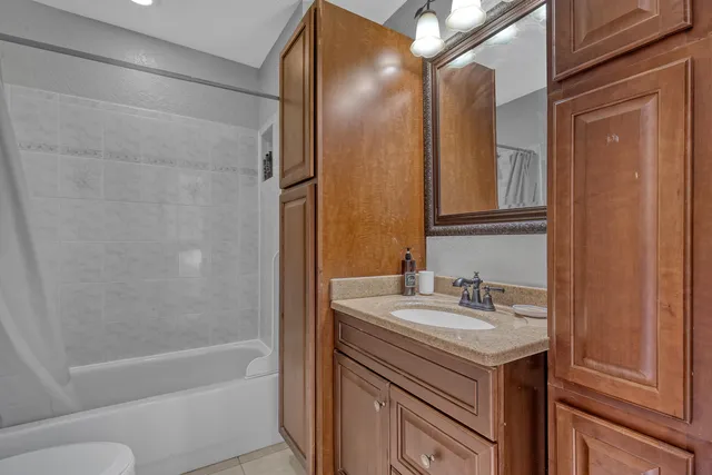 a kitchen with white cabinets stainless steel appliances and sink