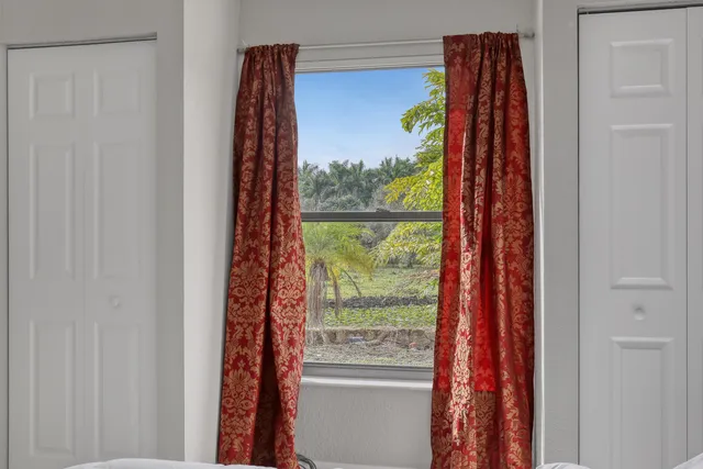 a view of a livingroom with wooden floor and a window