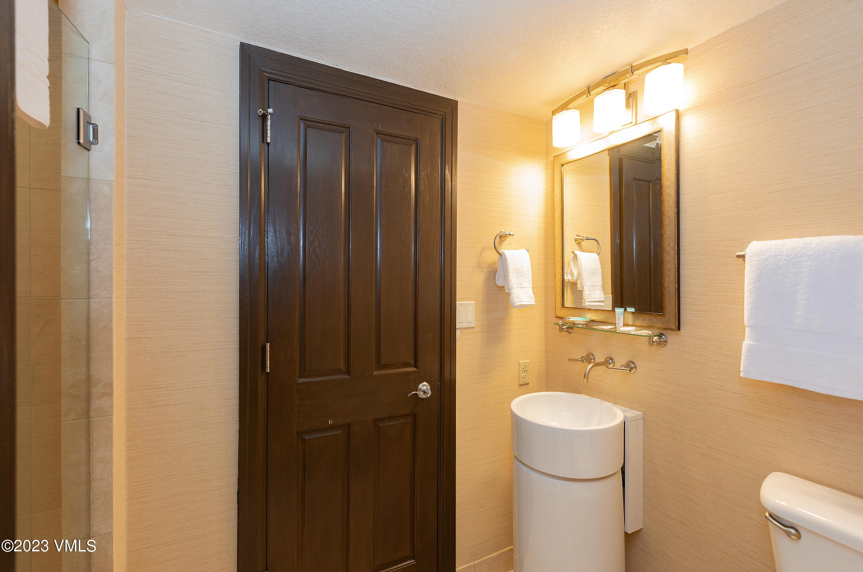 210 Offerson Road, Unit 107 WEEK 5 Beaver Creek, CO 81620 - Photo 19 of 27 a bathroom with a sink a toilet and shower