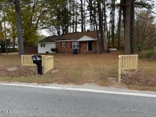 1277 Buffalo Road Smithfield, NC 27577 - Photo 2 of 14 a front view of a house with a yard