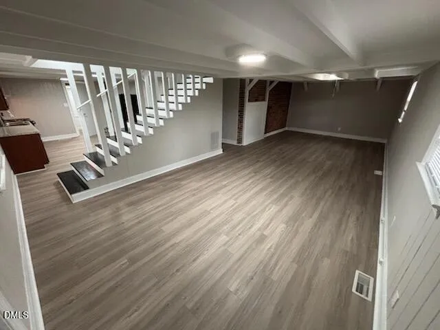 a view of an empty room with stairs