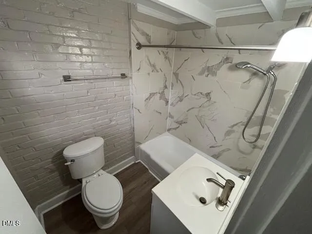 a white toilet sitting next to a bathroom sink