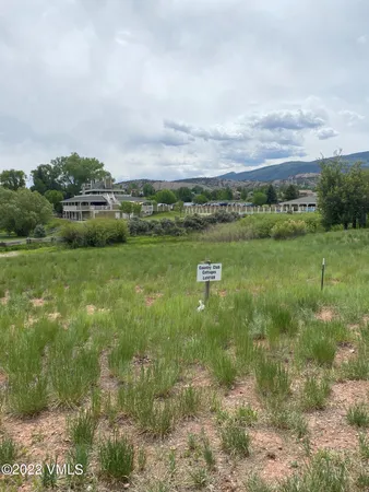 a view of a lake with houses in the back