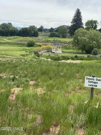 a view of a golf course with a lake