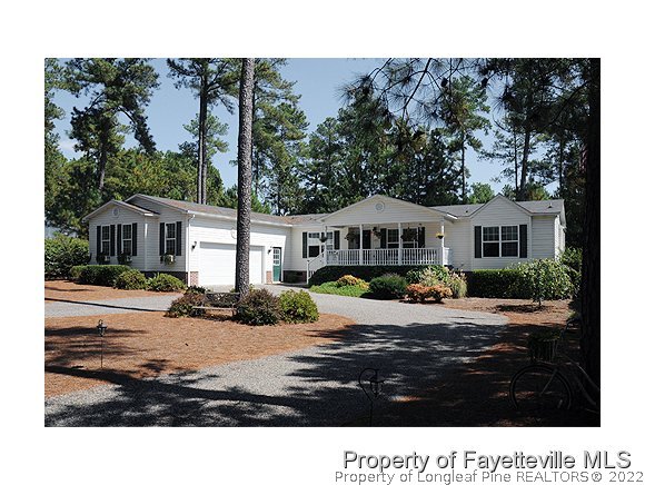 293 Ridge View Drive Cameron, NC 28326 - Photo 1 of 25 a house view with a garden space