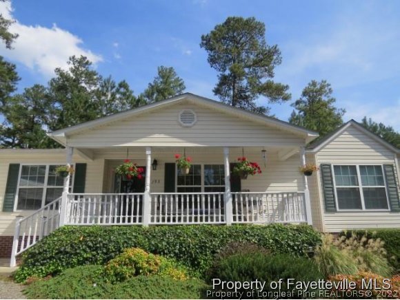 293 Ridge View Drive Cameron, NC 28326 - Photo 2 of 25 a front view of a house with a garden