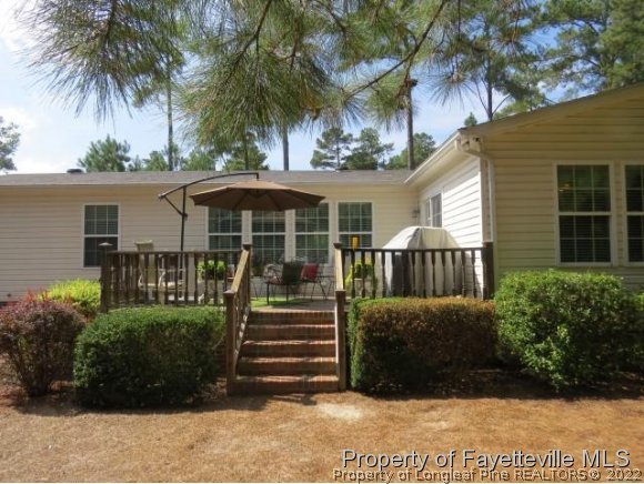 293 Ridge View Drive Cameron, NC 28326 - Photo 23 of 25 a front view of a house with a garden