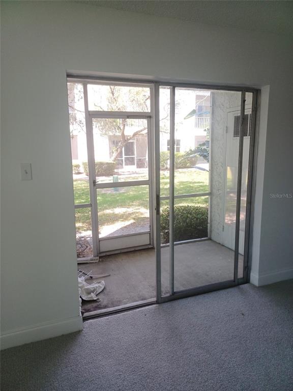 245 South McMullen Booth Road, Unit 17 Clearwater, FL 33759 - Photo 3 of 4 an empty room with windows