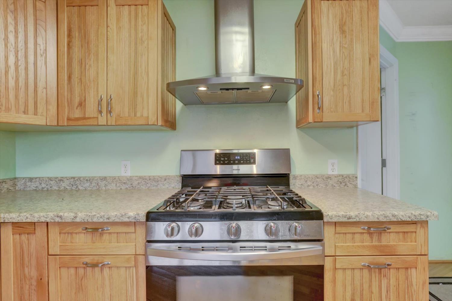 19121 Hiers Road Grass Valley, CA 95949 - Photo 11 of 94 a kitchen with granite countertop a stove and a sink
