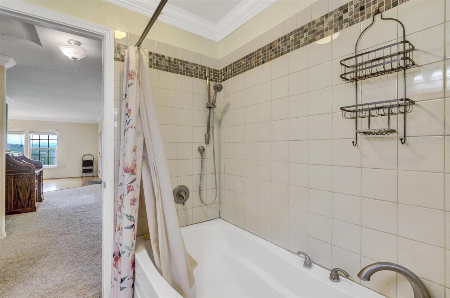 19121 Hiers Road Grass Valley, CA 95949 - Photo 35 of 94 a bathroom with a bathtub and shower