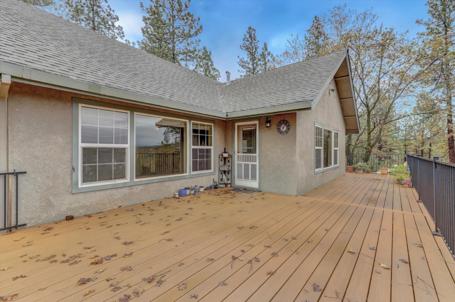19121 Hiers Road Grass Valley, CA 95949 - Photo 42 of 94 a view of a house with a wooden deck